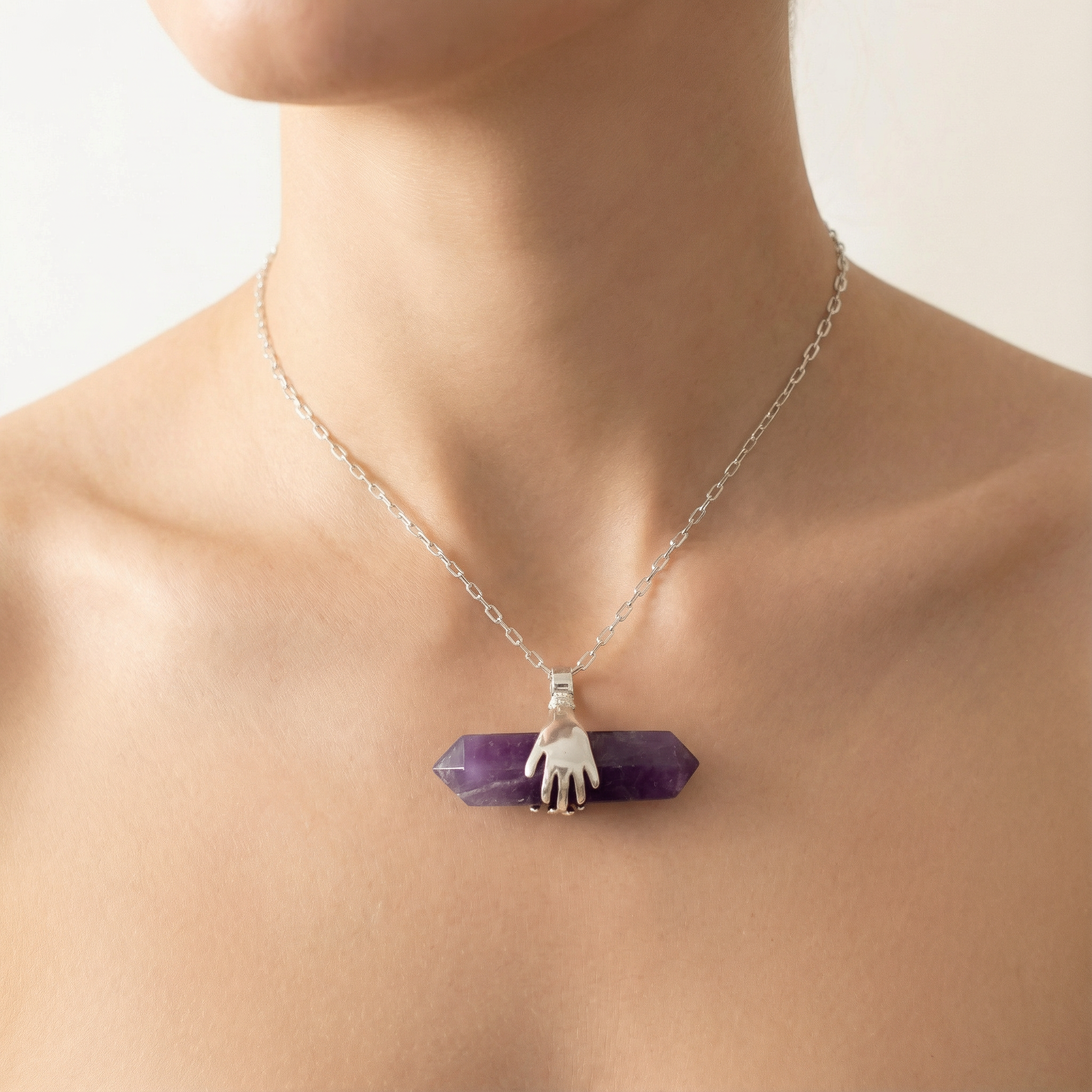 Hands Holding Chevron Amethyst – Double Point Pendant